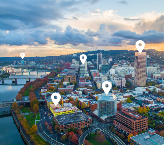 Willamette River and Eastside Portland aerial view in the Fall, with map marker graphical elements above some buildings