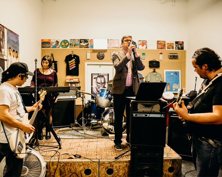 a band performing in a record shop