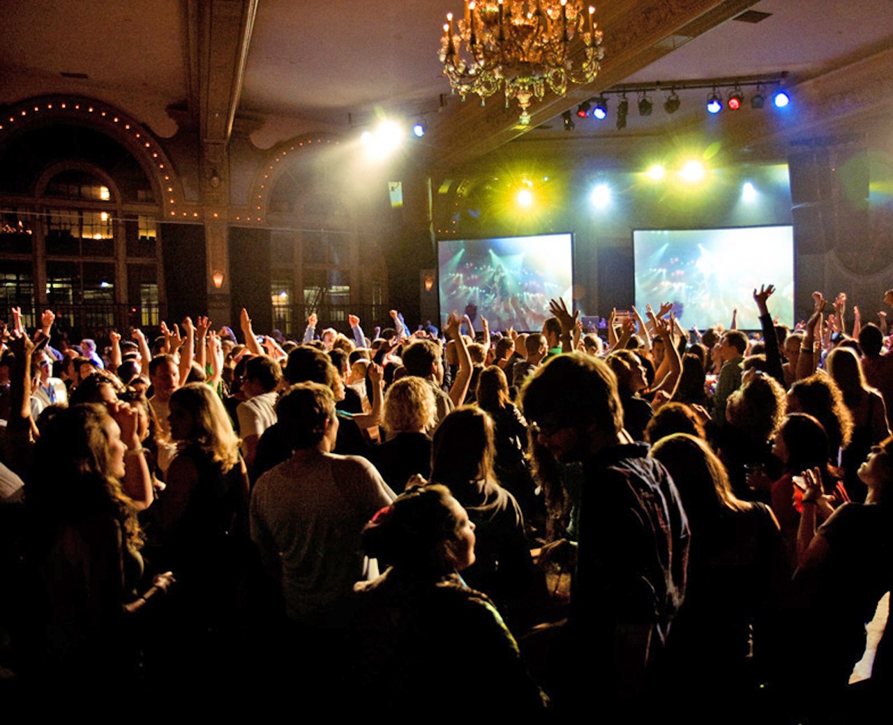 a crowd dancing at a nightclub