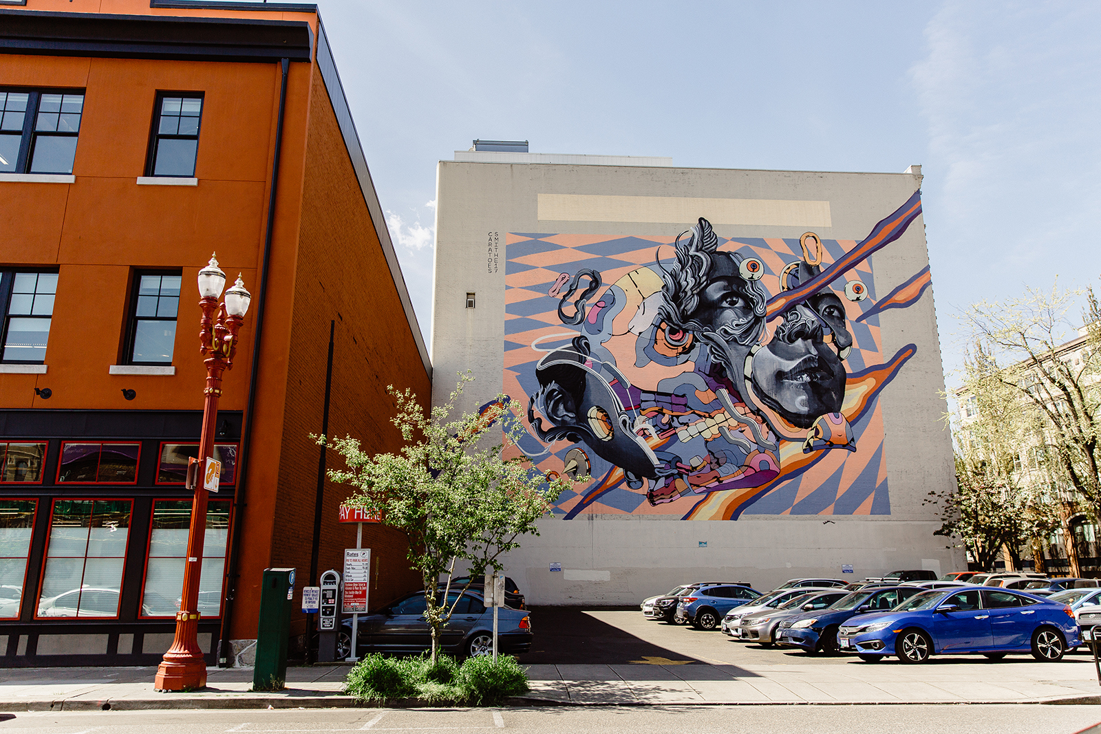 mural on side of building on a city street