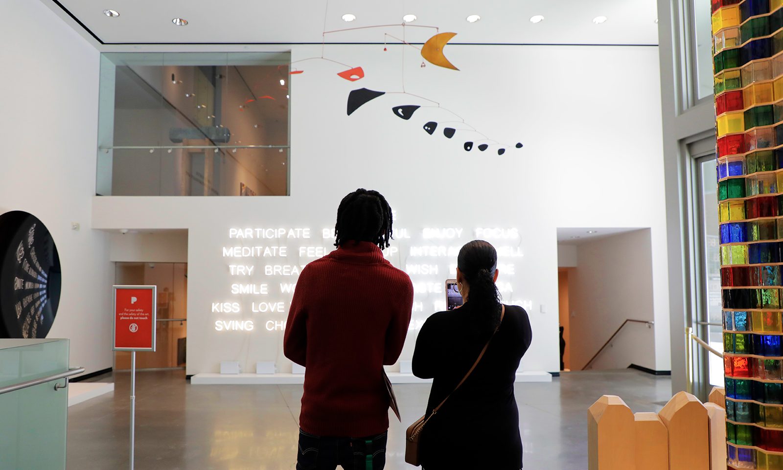 a couple observes artwork at Portland Art Museum