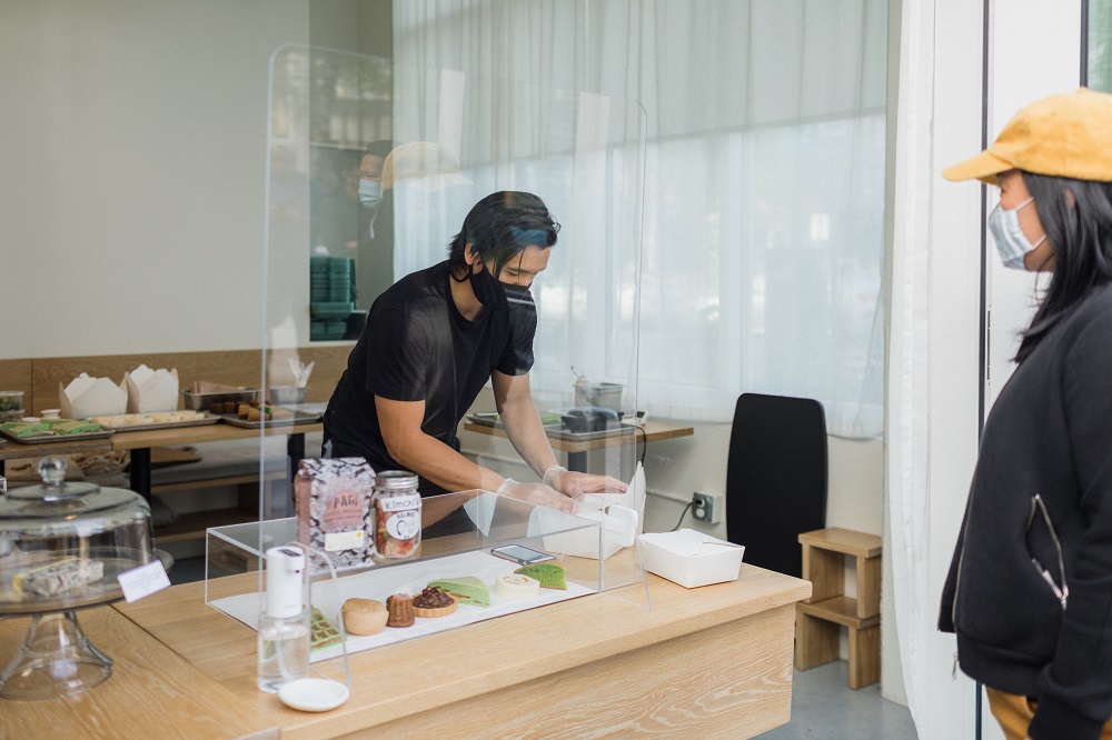 Chef Vincent Nguyen assists a customer at Berlu.
