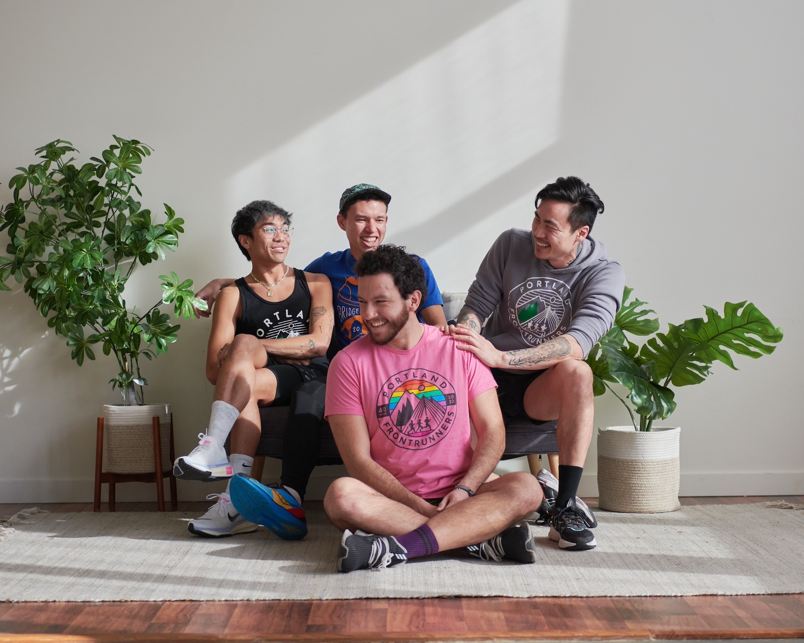 Four People Laughing on a Couch