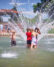 Little ones love to splash in the public fountain at Peninsula Park in North Portland.