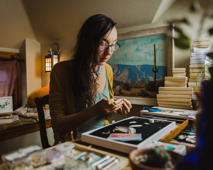 woman making jewelry