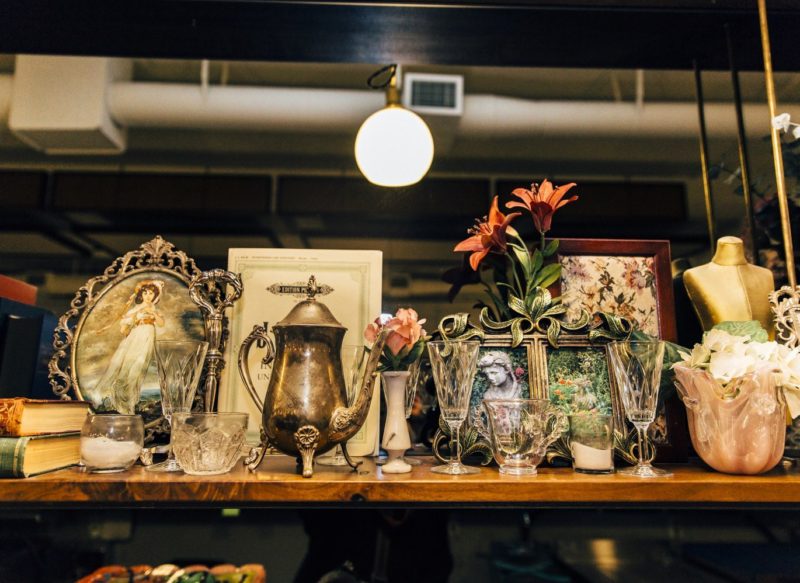A display of various teapots and flowers for the Nightwood Society