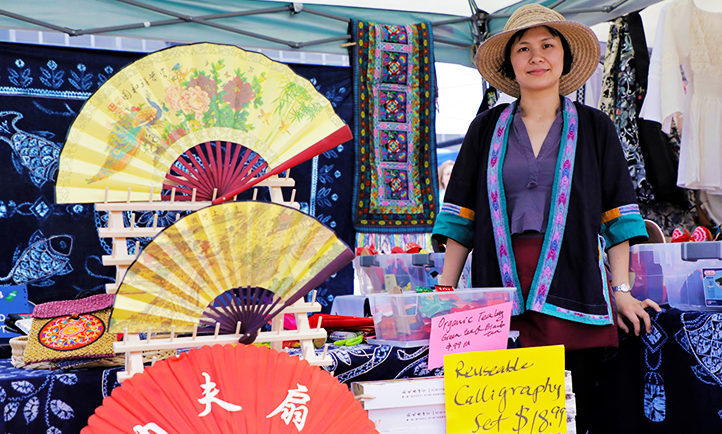 Colorful arrays of fans, reusable calligraphy sets and more at local vendor's My People's Market booth in summer 2018.