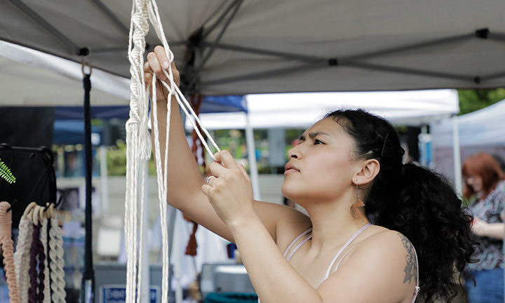 An artist at work at My People's Market in summer 2018.